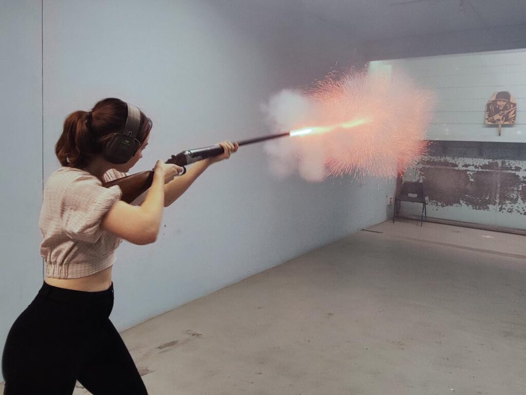 Actress learning how to use shotguns at London Scottish House, Bare Arms firearms training