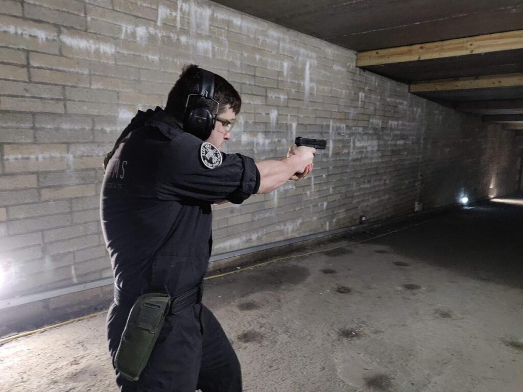 Student learning how to use a pistol on a theatrical firearms course